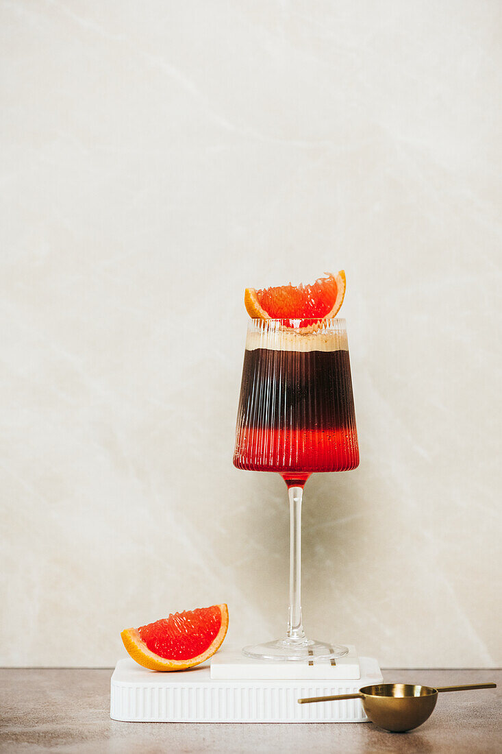 Summer cocktail of grapefruit juice, Aperol, tonic and coffee