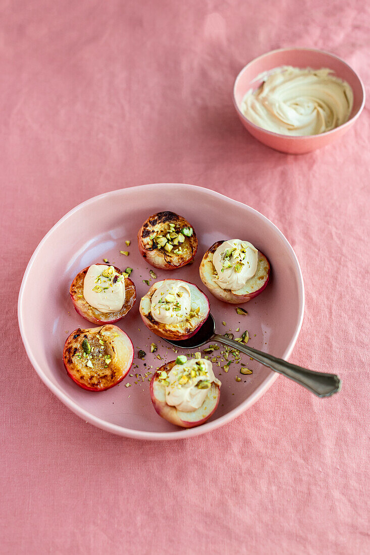 Roasted white nectarines with tahini cream and pistachios