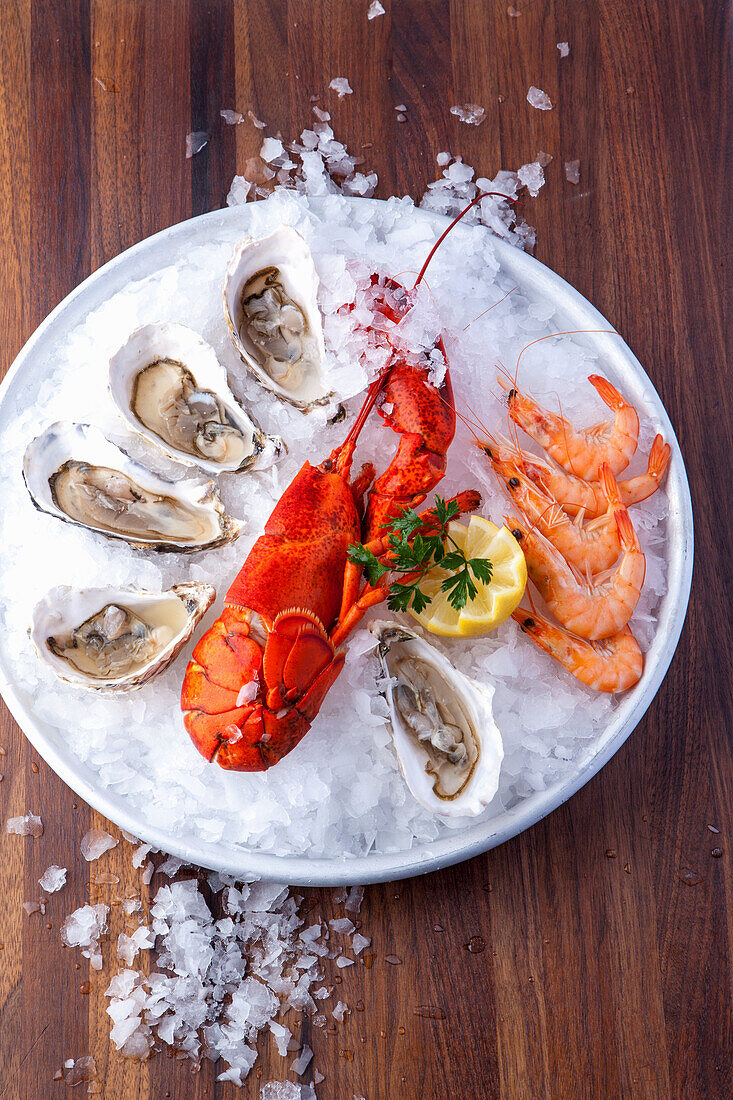 Oysters, lobster and shrimp on ice