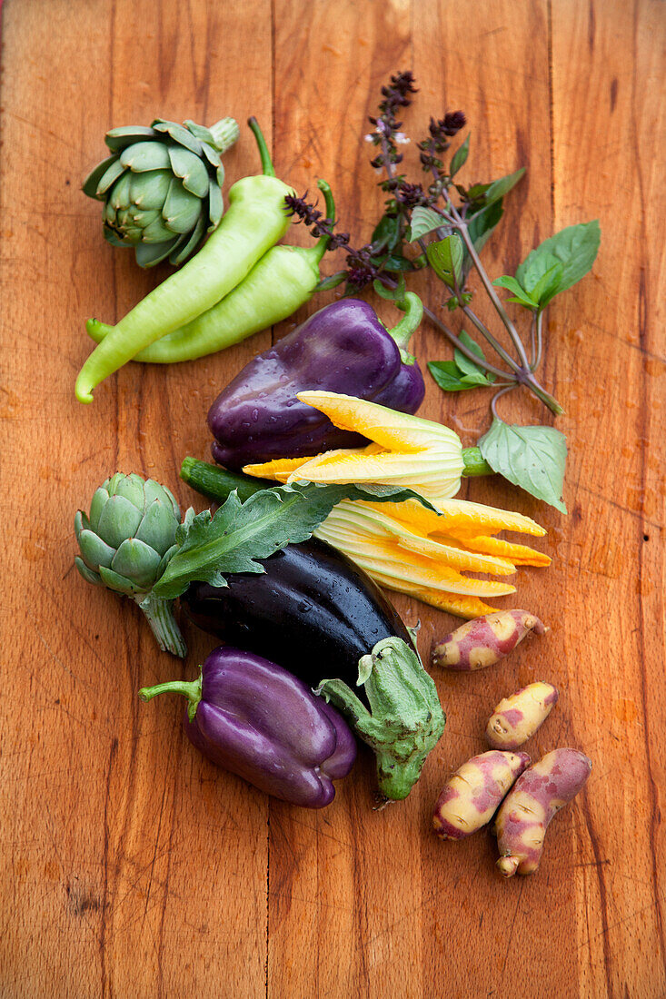 Fresh vegetables, zucchini flowers and herbs