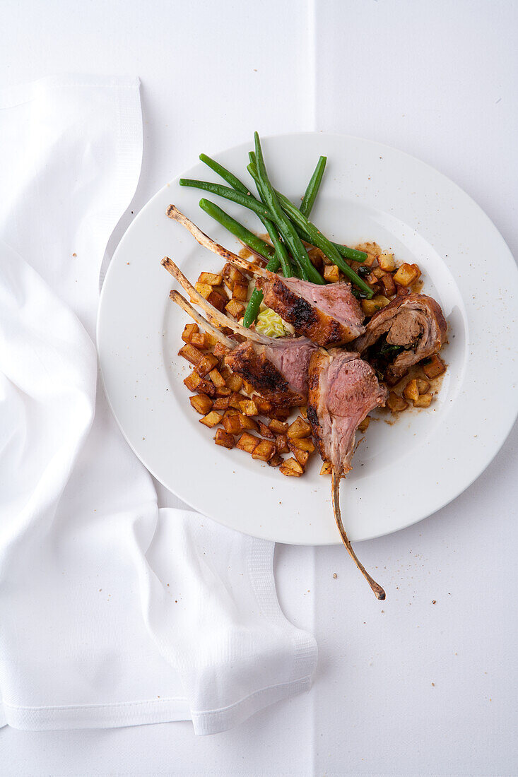 Lamb cutlet with roast potatoes and green beans