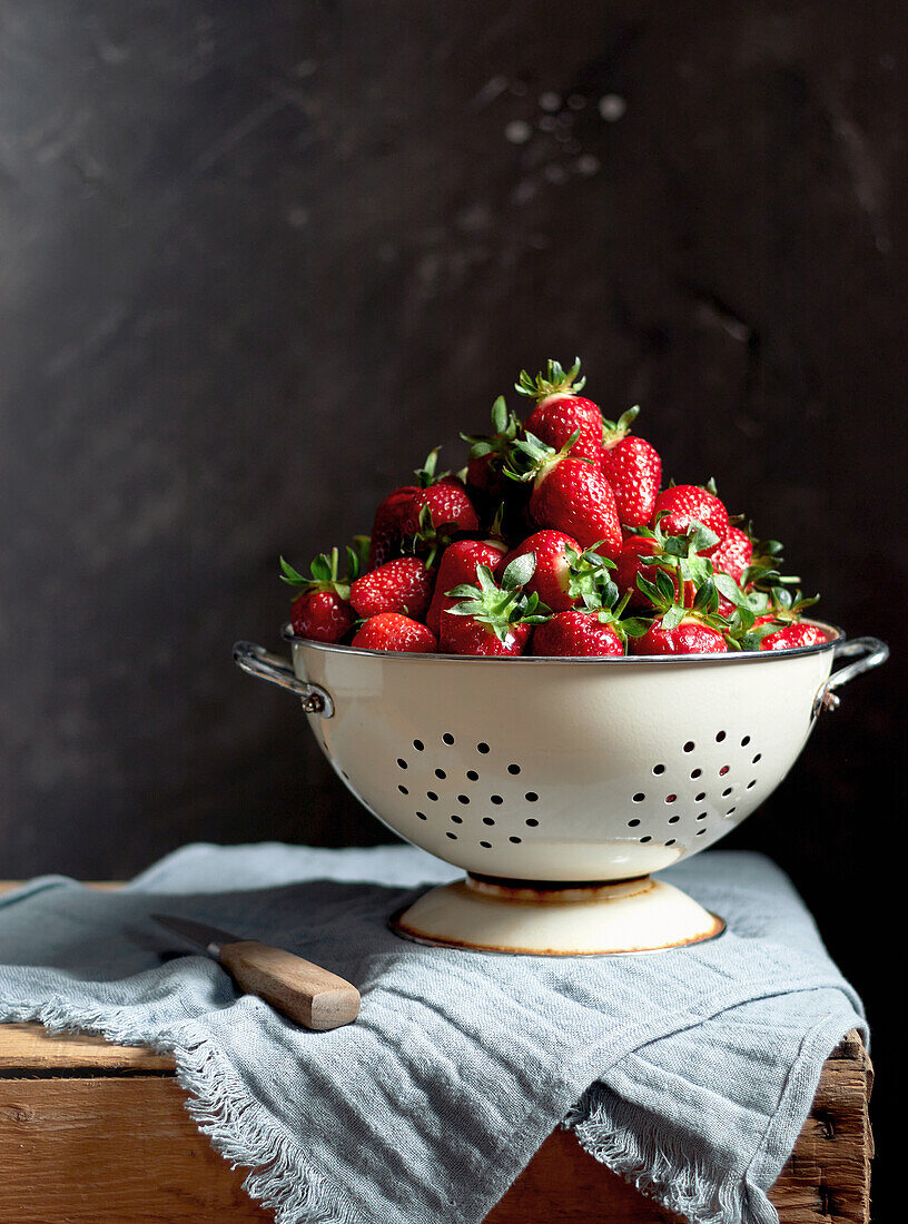 Fresh strawberries in a sieve