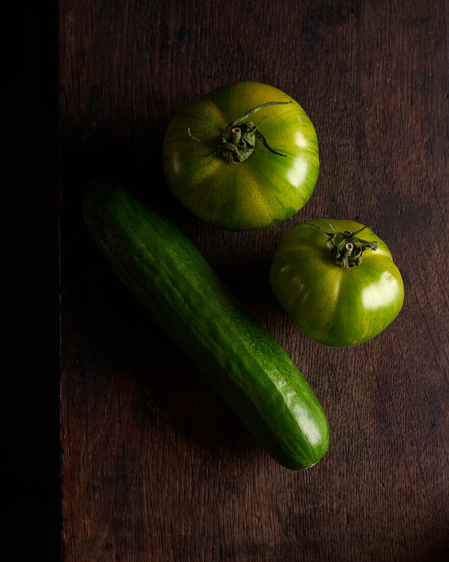 Green tomatoes and a cucumber
