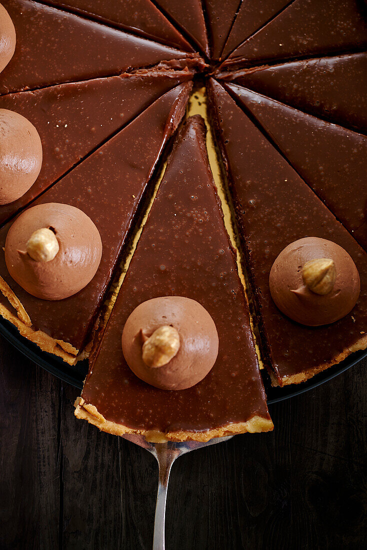 Chocolate tart with hazelnut cream dots