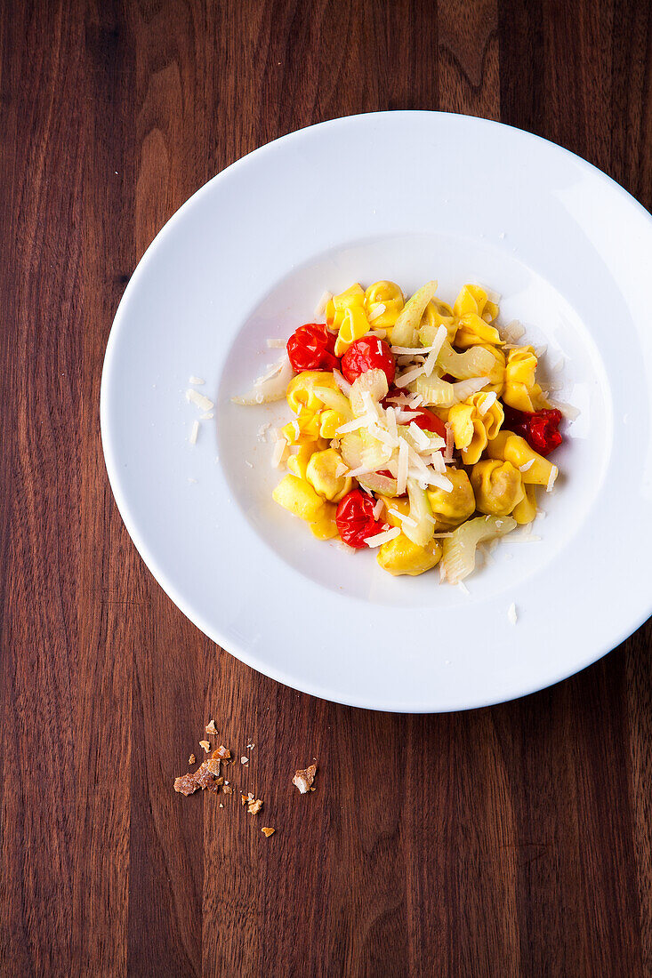 Tortellini with tomatoes, celery and parmesan cheese