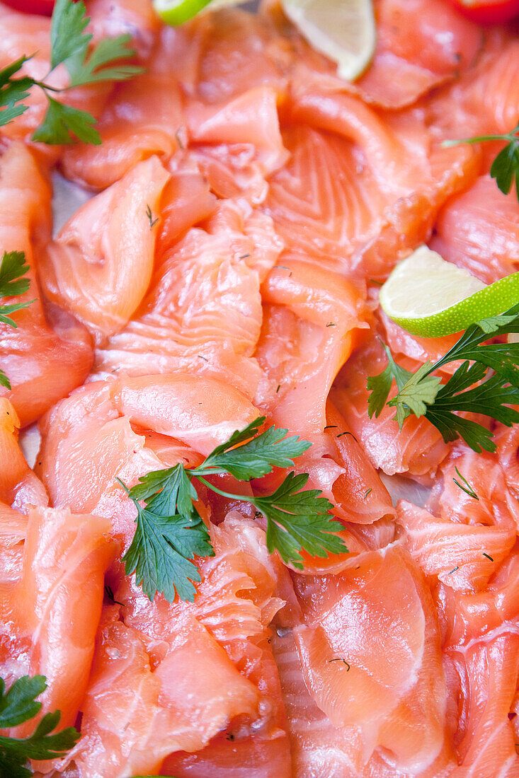 Smoked salmon slices with flat-leaf parsley
