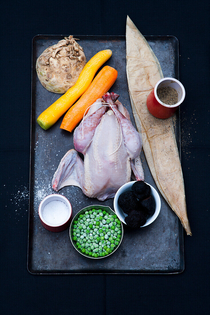 Whole chicken, vegetables, spices and truffles
