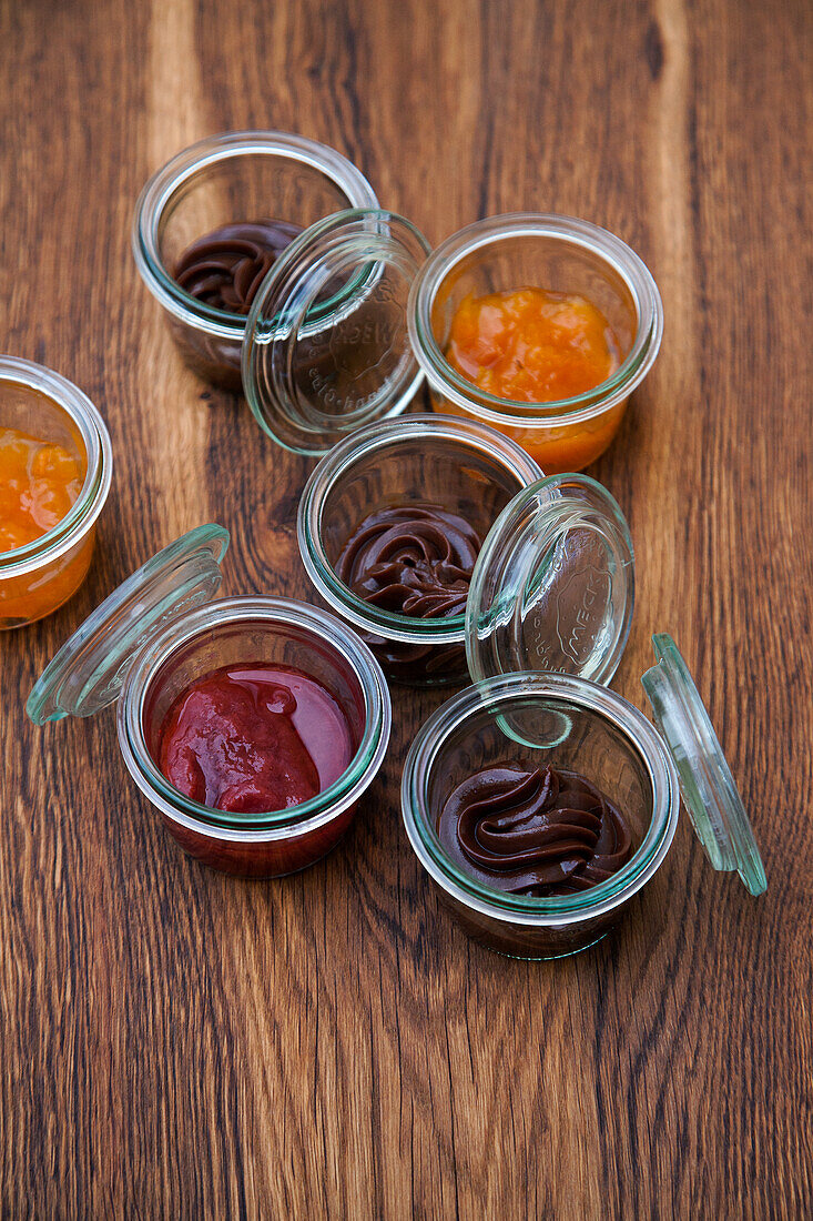 Fruit compote and chocolate mousse in glasses