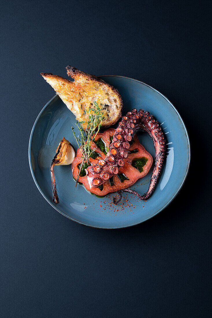 Octopus with toasted farmhouse bread, tomato and garlic
