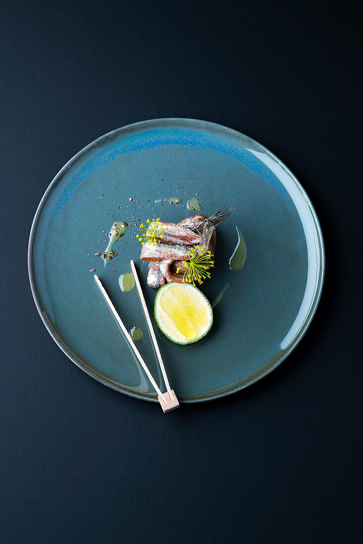 Pickled sardines with fennel flowers and lime