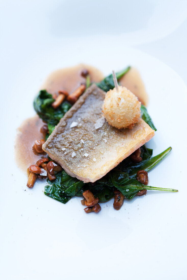 Trout with chanterelles and spinach