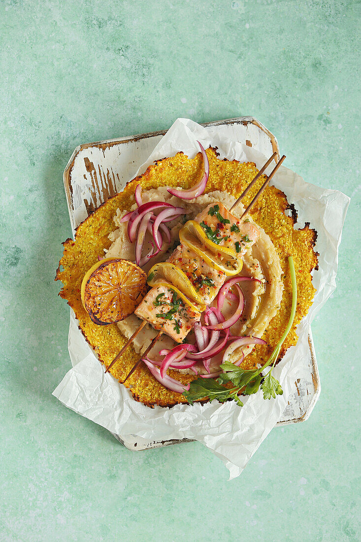 Salmon skewers with gluten-free cauliflower tortillas and white bean puree