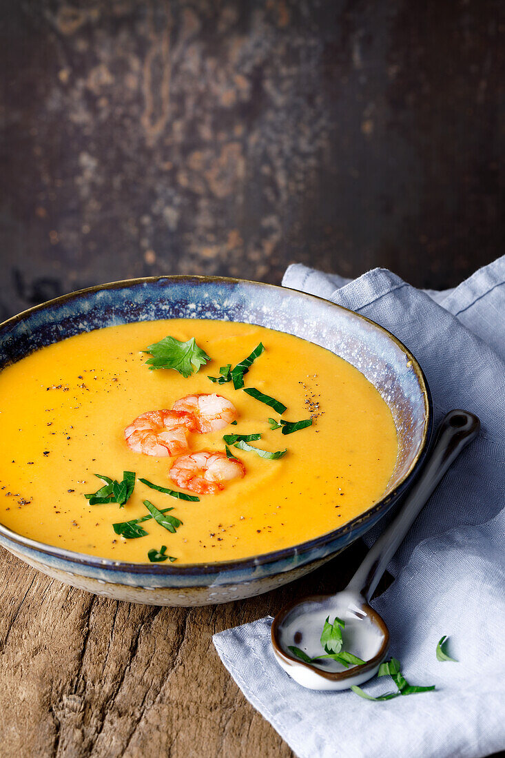Orange-carrot soup with shrimp