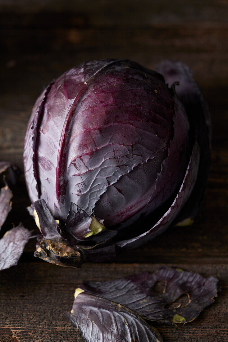 Red cabbage on a wooden background