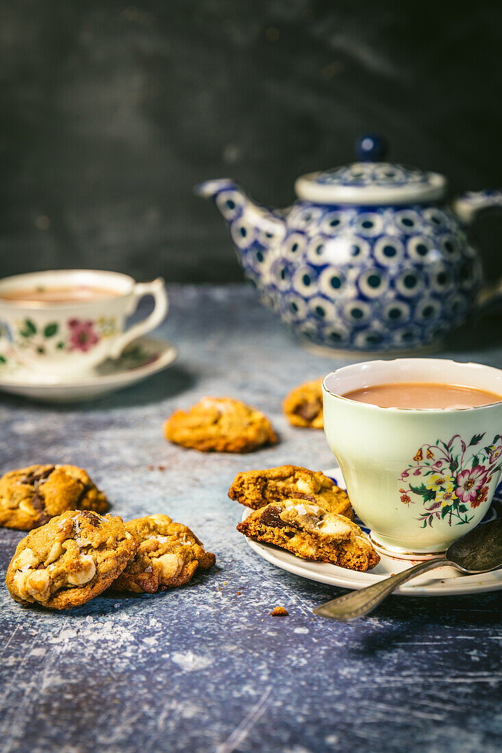 Chocolate chip cookies and tea with milk