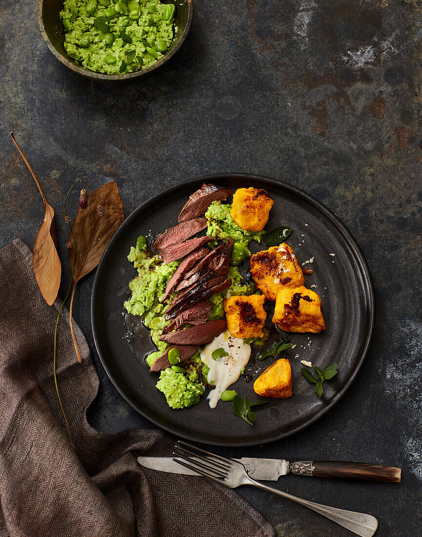 Saddle of hare with broad bean mash and pumpkin polenta