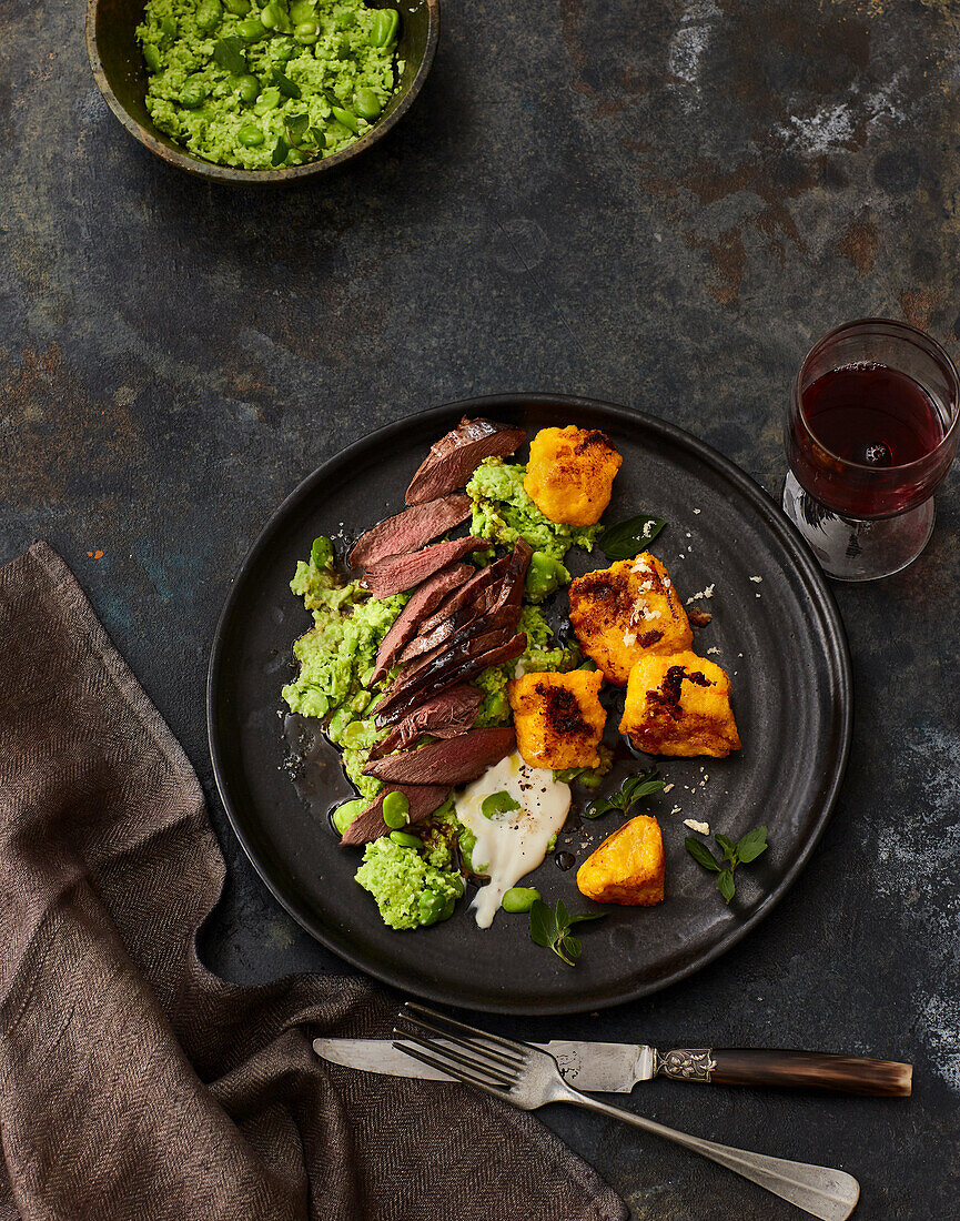 Saddle of hare with broad bean mash and pumpkin polenta