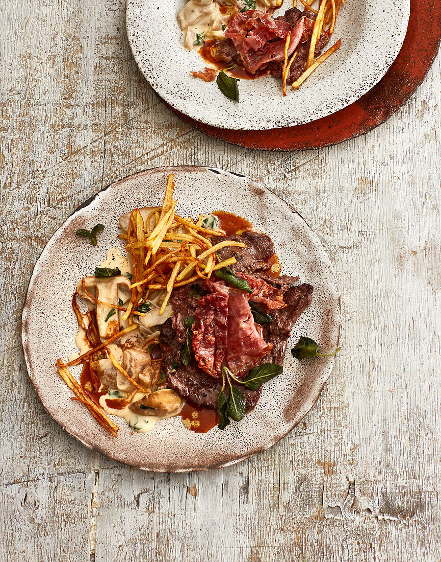 Venison saltimbocca with Marsala sauce, creamy porcini mushrooms, and straw potatoes