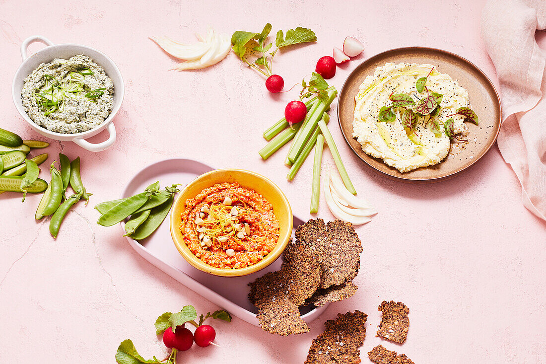 Creamy spinach dip, almond and red capsicum dip and whipped fetta dip