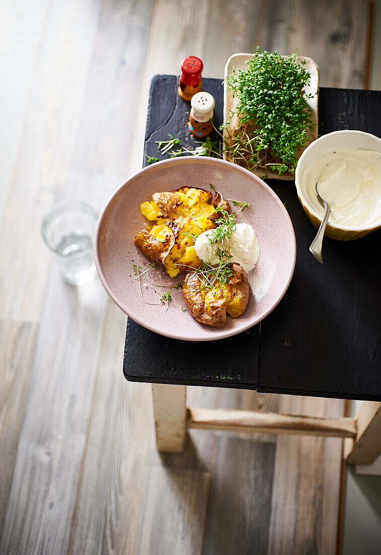 Smashed potatoes with cress sour cream