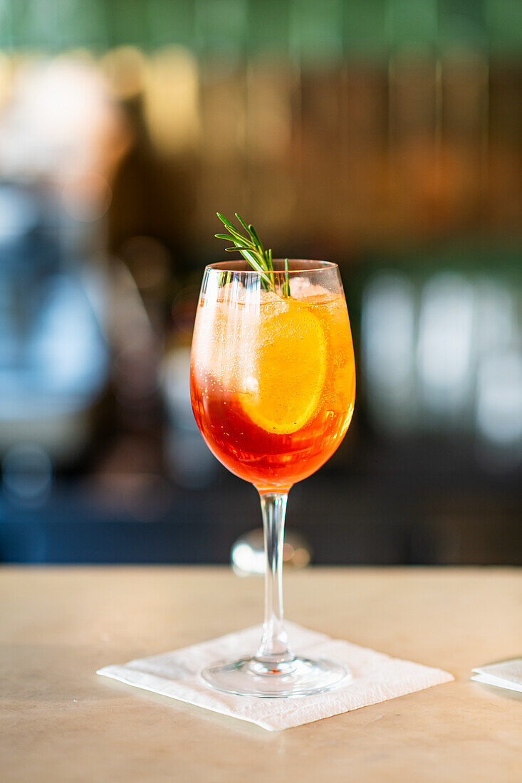 Aperol Spritz with rosemary garnish