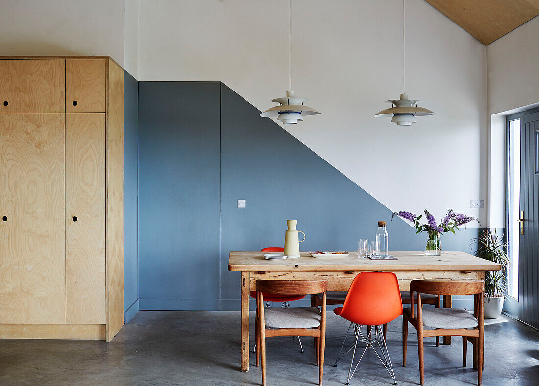 Pendant lights above table with chairs and wooden storage in Sligo newbuild, Ireland