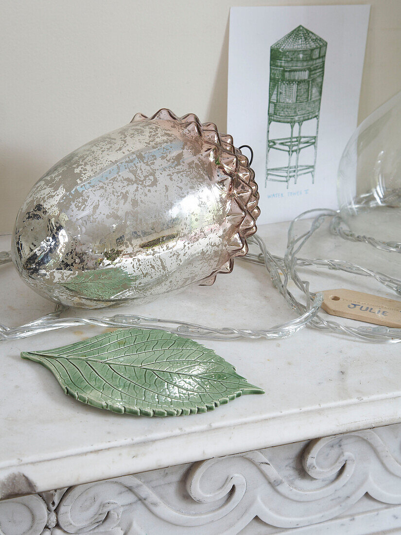 Lighting and ornament on a mantelpiece