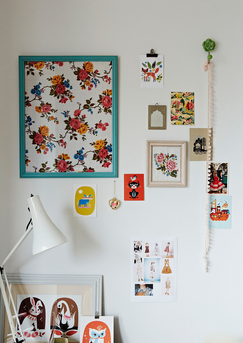 Artwork display and white desk lamp in Colchester family home, Essex, England, UK