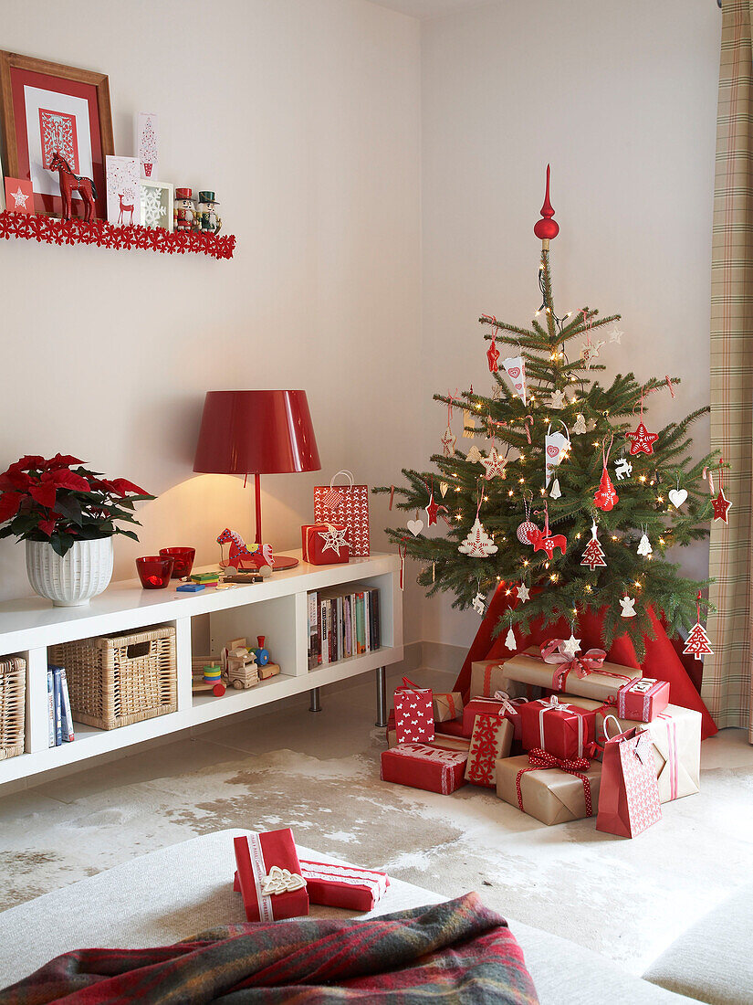 Christmas presents under tree in Polish family home