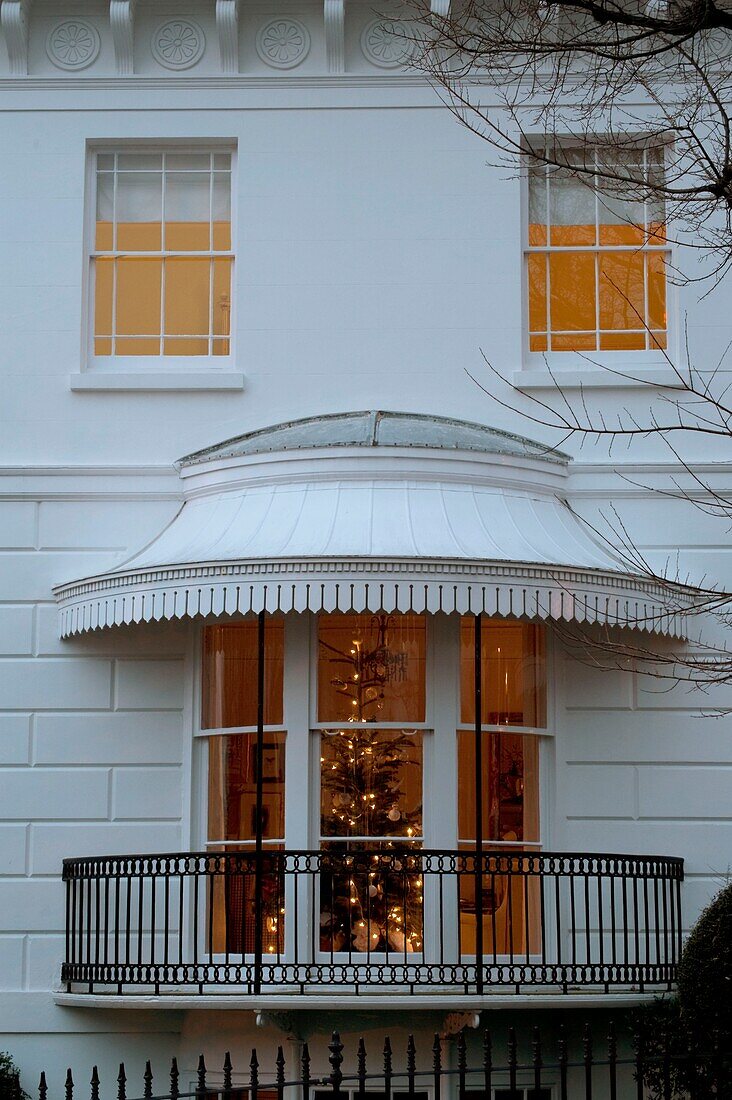 Christmas tree illuminated in house window