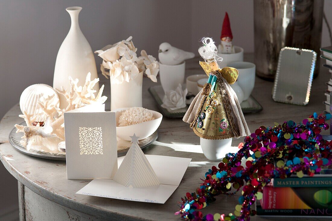 Christmas card and decorations on table