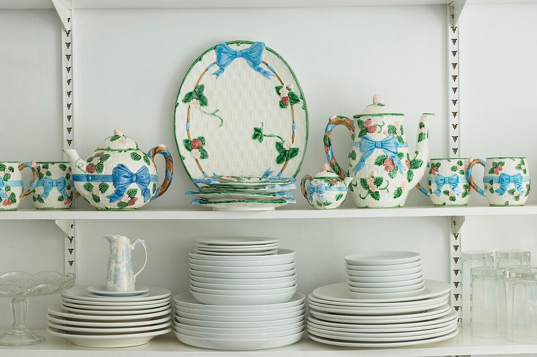 Coffee set and crockery on the shelf