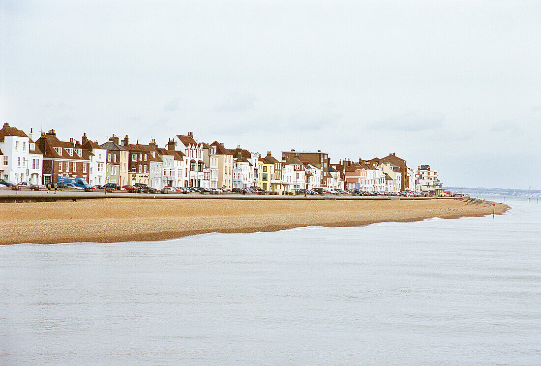 Deal Beach front with colourfully painted houses along the street