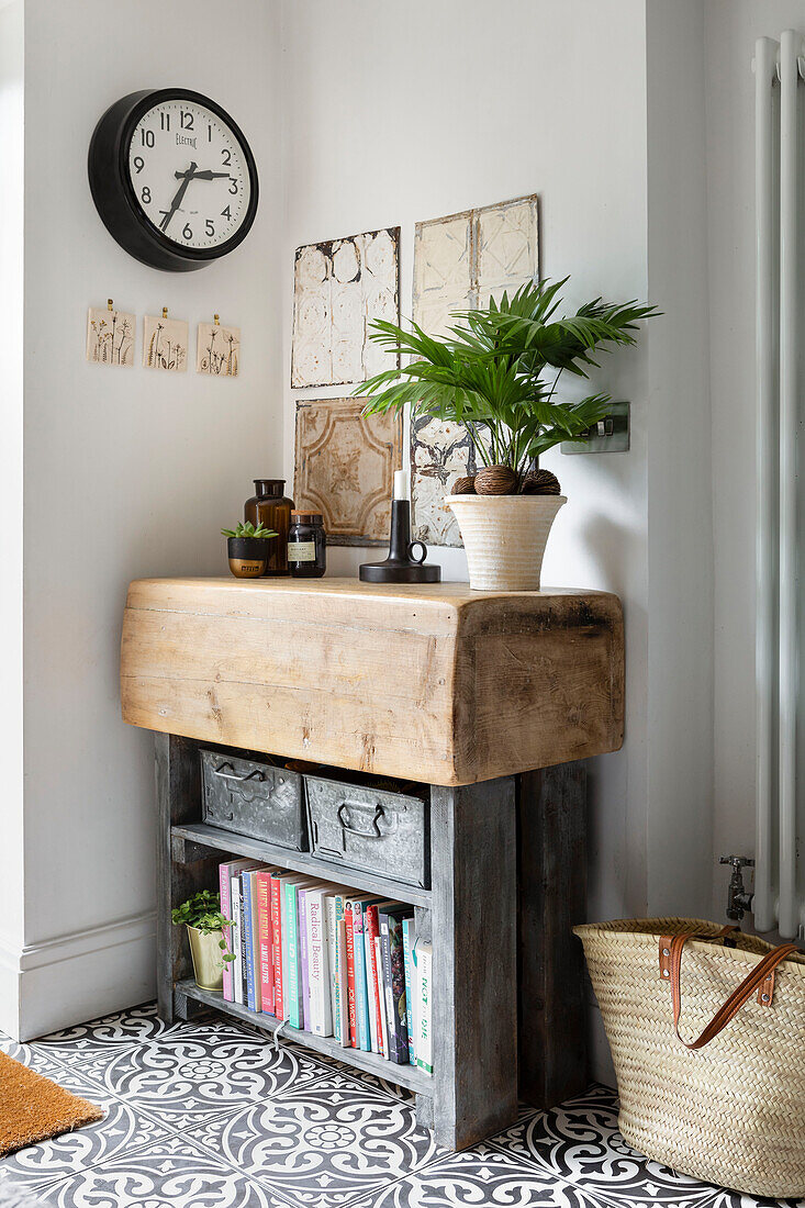 Butchers block with metal boxes and books in corner of Rustic kitchen Cardiff, Wales, UK