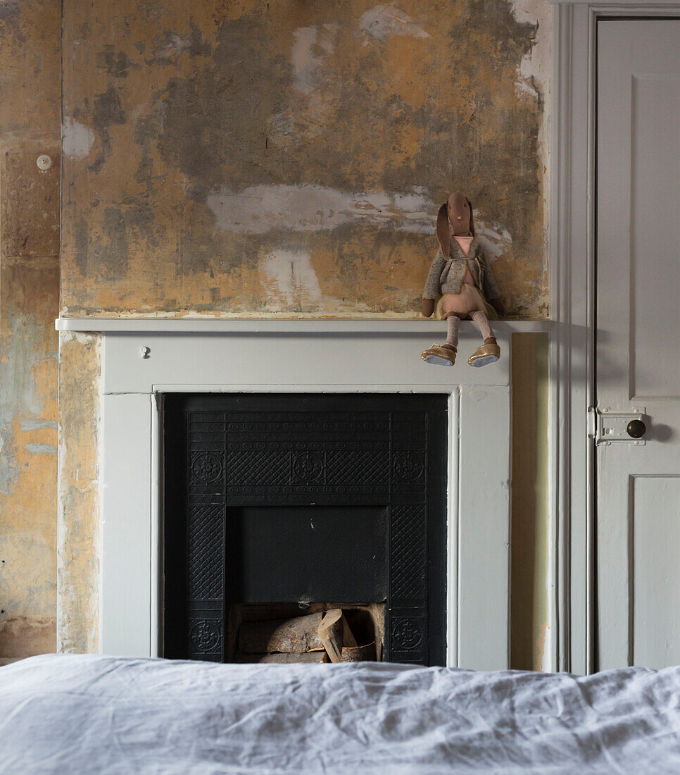 Soft toy on mantlepiece in unfurnished bedroom of Somerset home UK