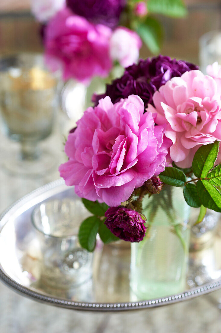 Cut flowers and silver tray in Iden farmhouse, Rye, East Sussex, UK