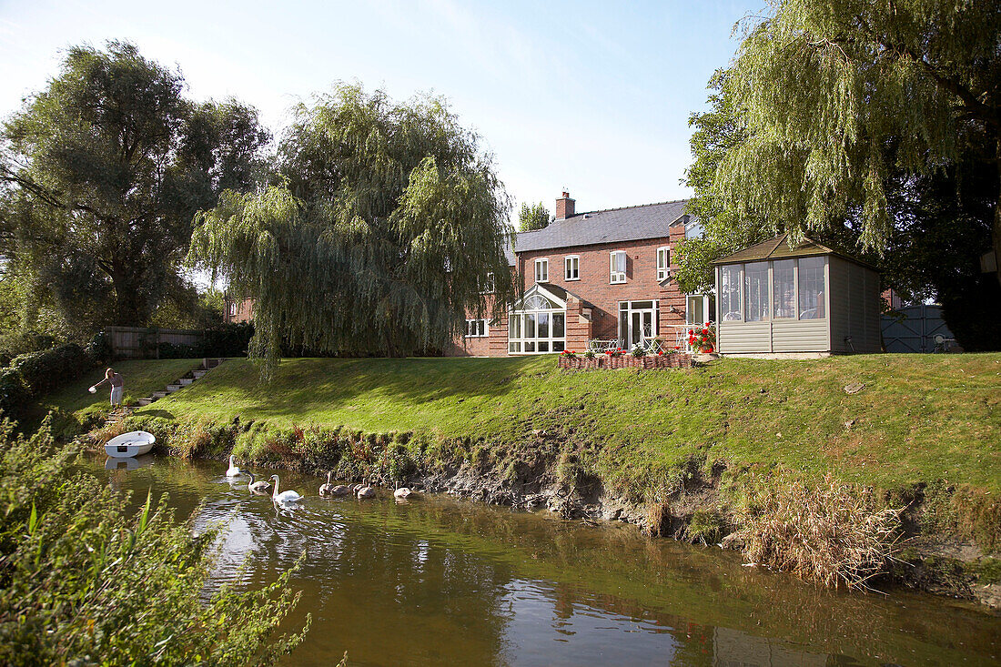 House next to small stream