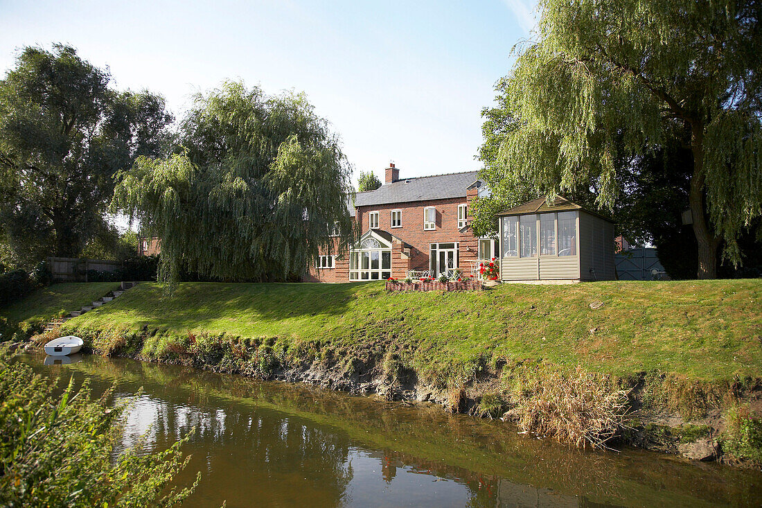 House next to small stream