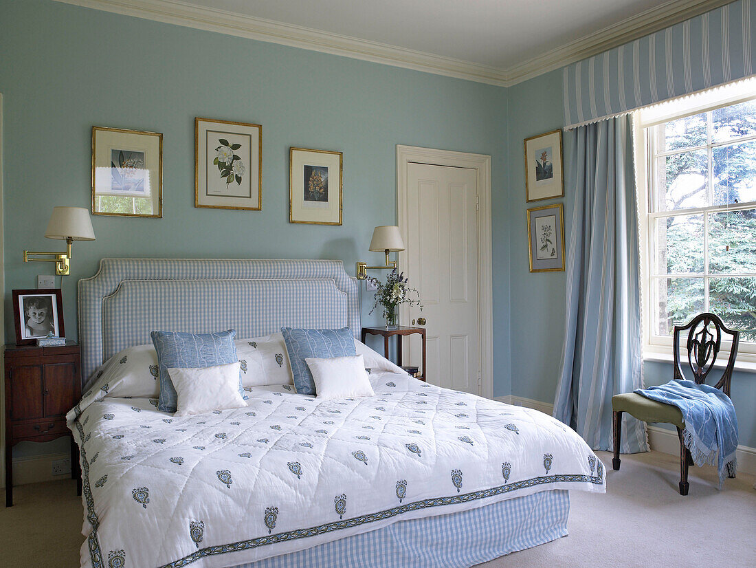 Pastel blue bedroom in Lincolnshire country house, England, UK
