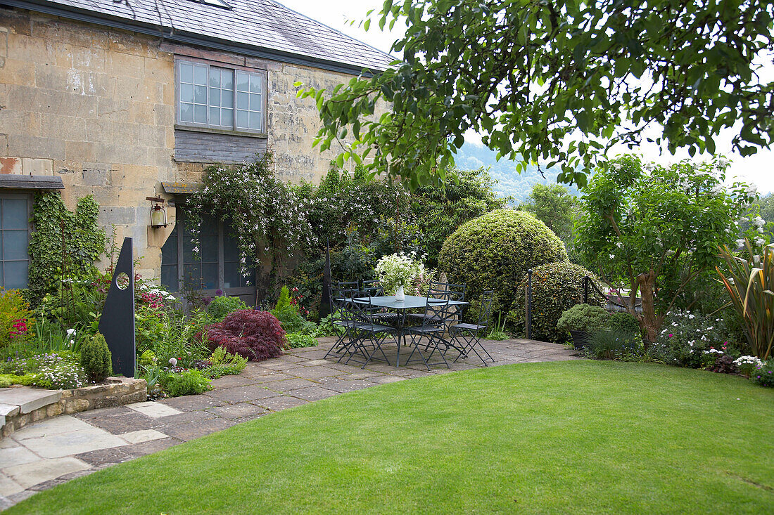 Back yard and limestone cottage