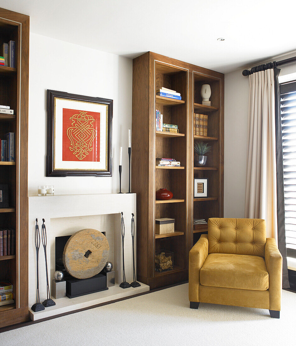 Modern living room with armchair and fireplace