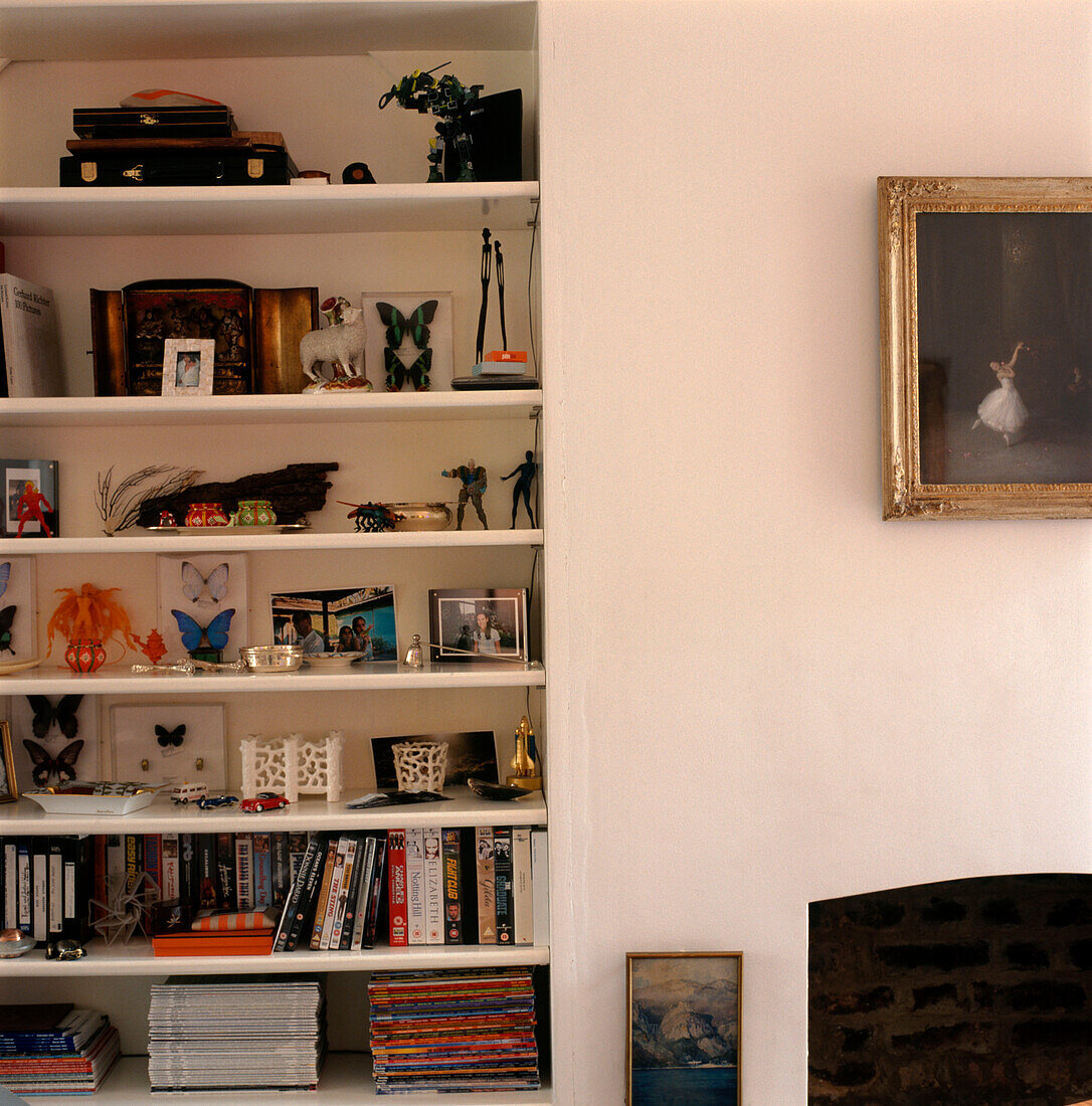 Large open storage shelves built in to a chimney breast alcove