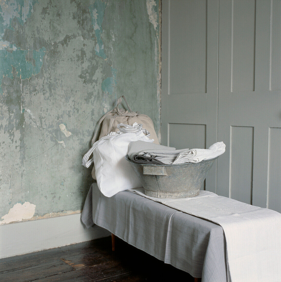 Linen bagged and folded in a spare room