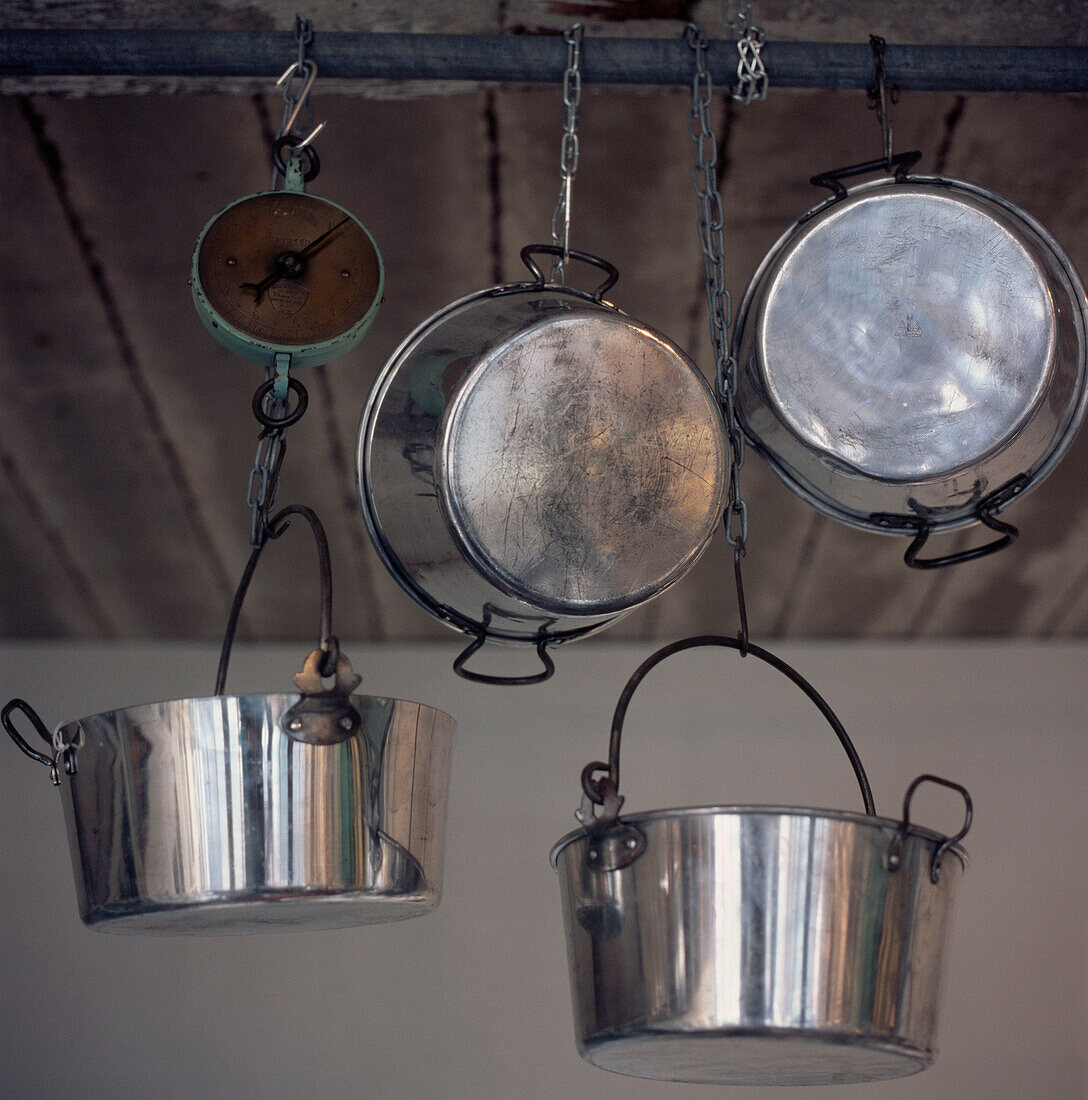 Rack of hanging jam making saucepans