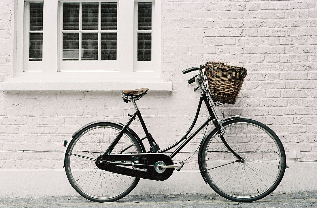 Bicycle propped up outside a house