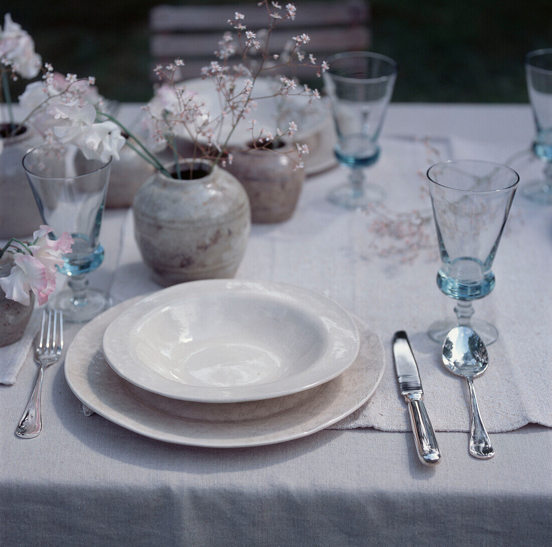 Detail of laid table setting with neutral home wares 