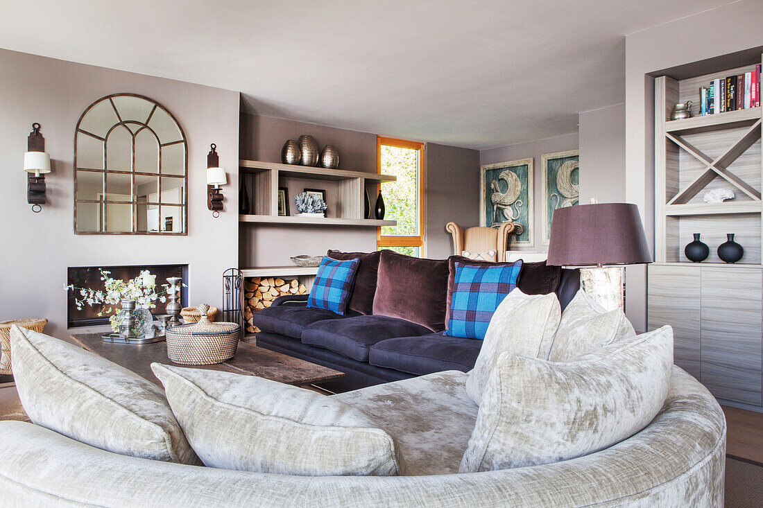 Contemporary living room with curved sofa in the Lakes, England, UK