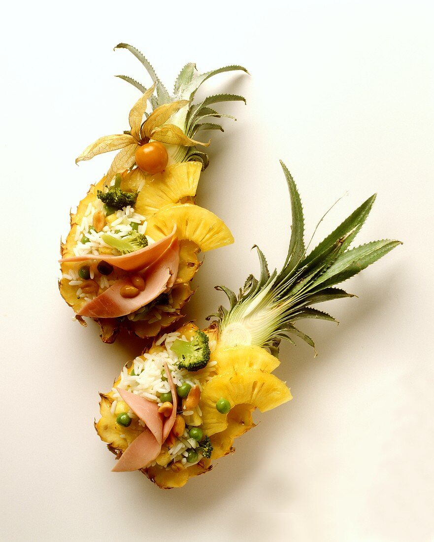 Pineapple halves filled with exotic rice salad