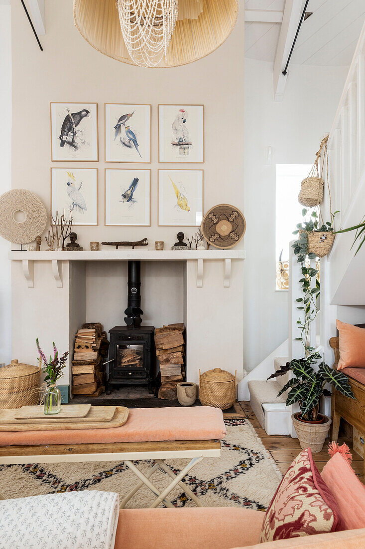 Woodburner and Japanese prints in living room of Devon cottage