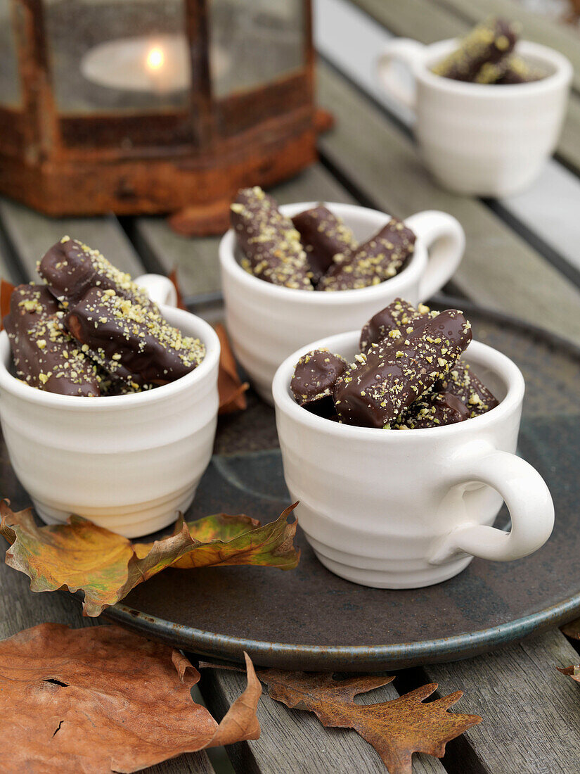 Chocolates in cups with lantern and lit lantern Brighton, East Sussex UK